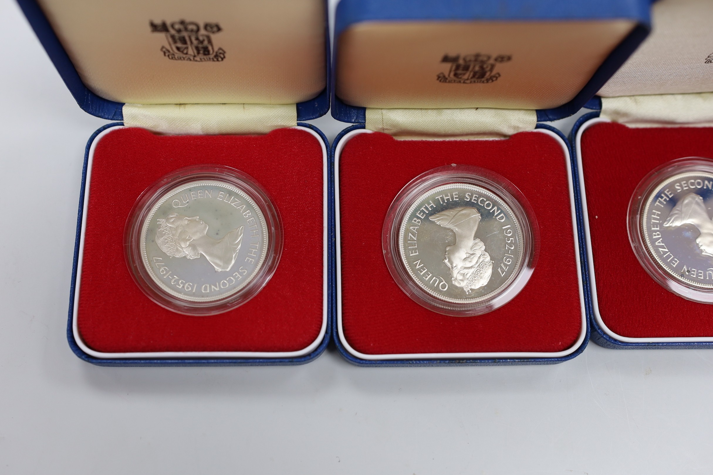 Eleven Royal Mint Commonwealth commemorative proof silver crowns